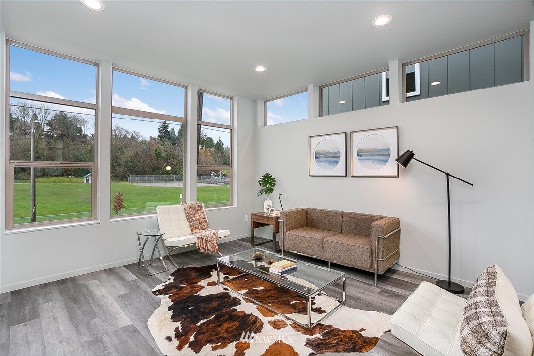 5257 Fauntleroy Way Southwest Seattle, WA 98136 - Photo 3 of 27 a living room with furniture and a large window