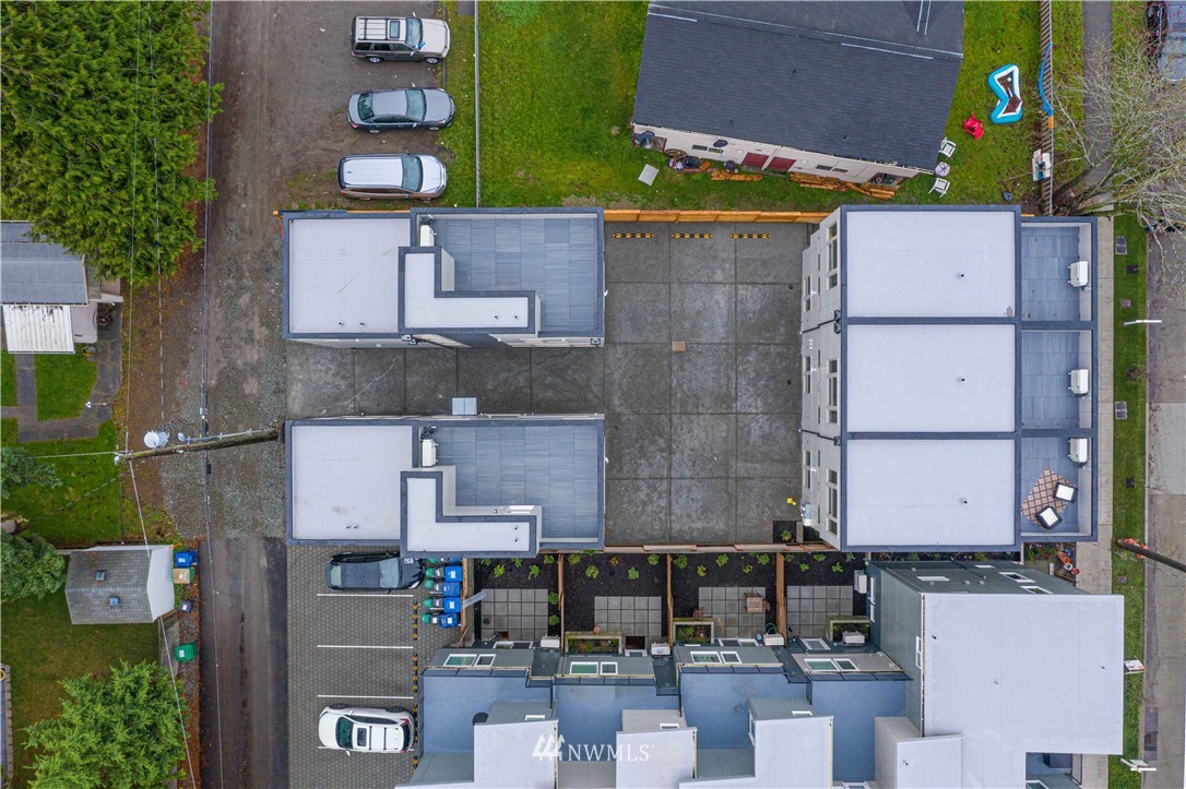 5257 Fauntleroy Way Southwest Seattle, WA 98136 - Photo 23 of 27 an aerial view of residential houses with outdoor space
