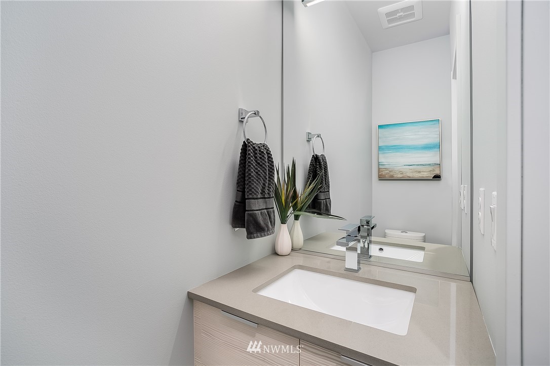 5257 Fauntleroy Way Southwest Seattle, WA 98136 - Photo 6 of 27 a bathroom with a sink vanity and a mirror