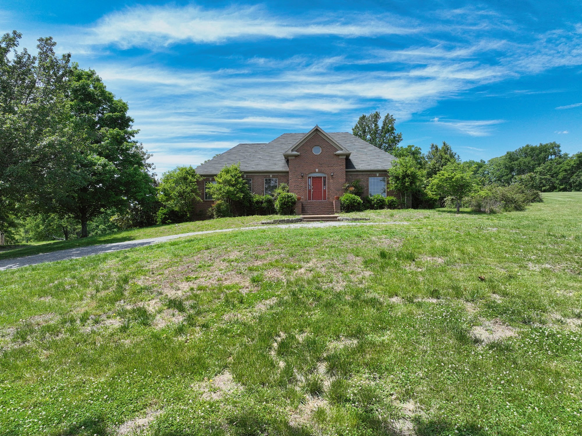 a front view of a house with a yard