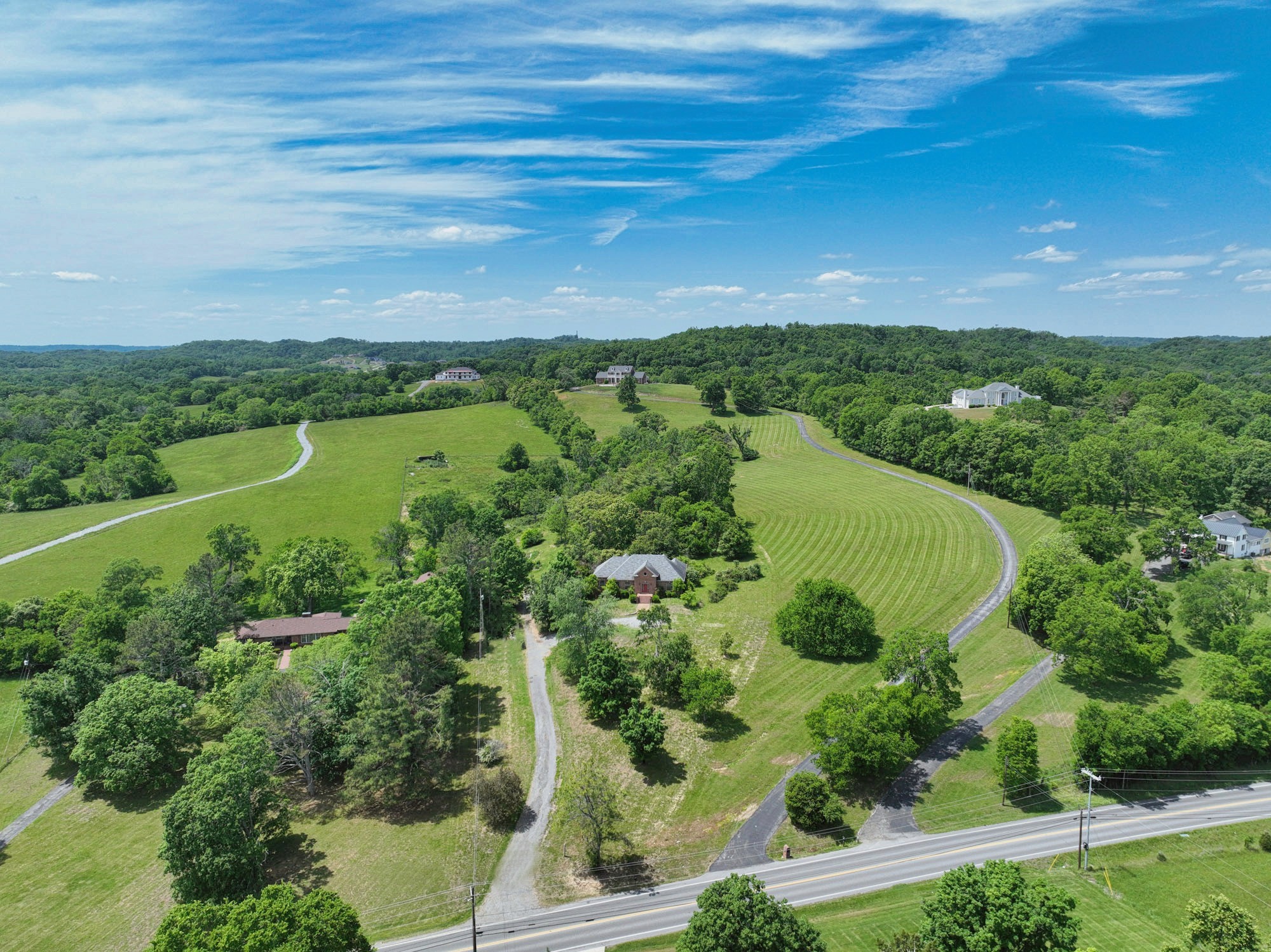795 New Shackle Island Road Hendersonville, TN 37075 - Photo 35 of 41 an aerial view of green landscape with trees houses and lake view