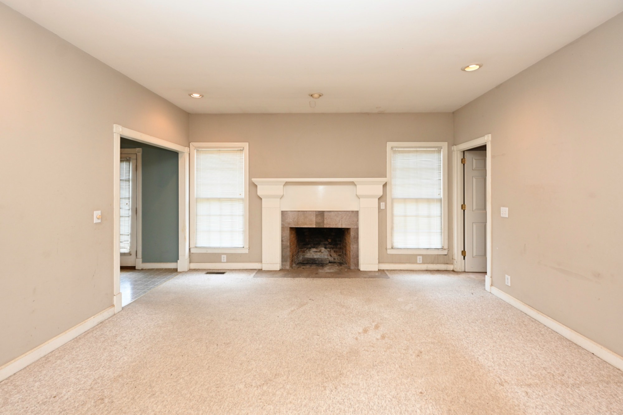 795 New Shackle Island Road Hendersonville, TN 37075 - Photo 6 of 41 a view of an empty room with a fireplace and a window