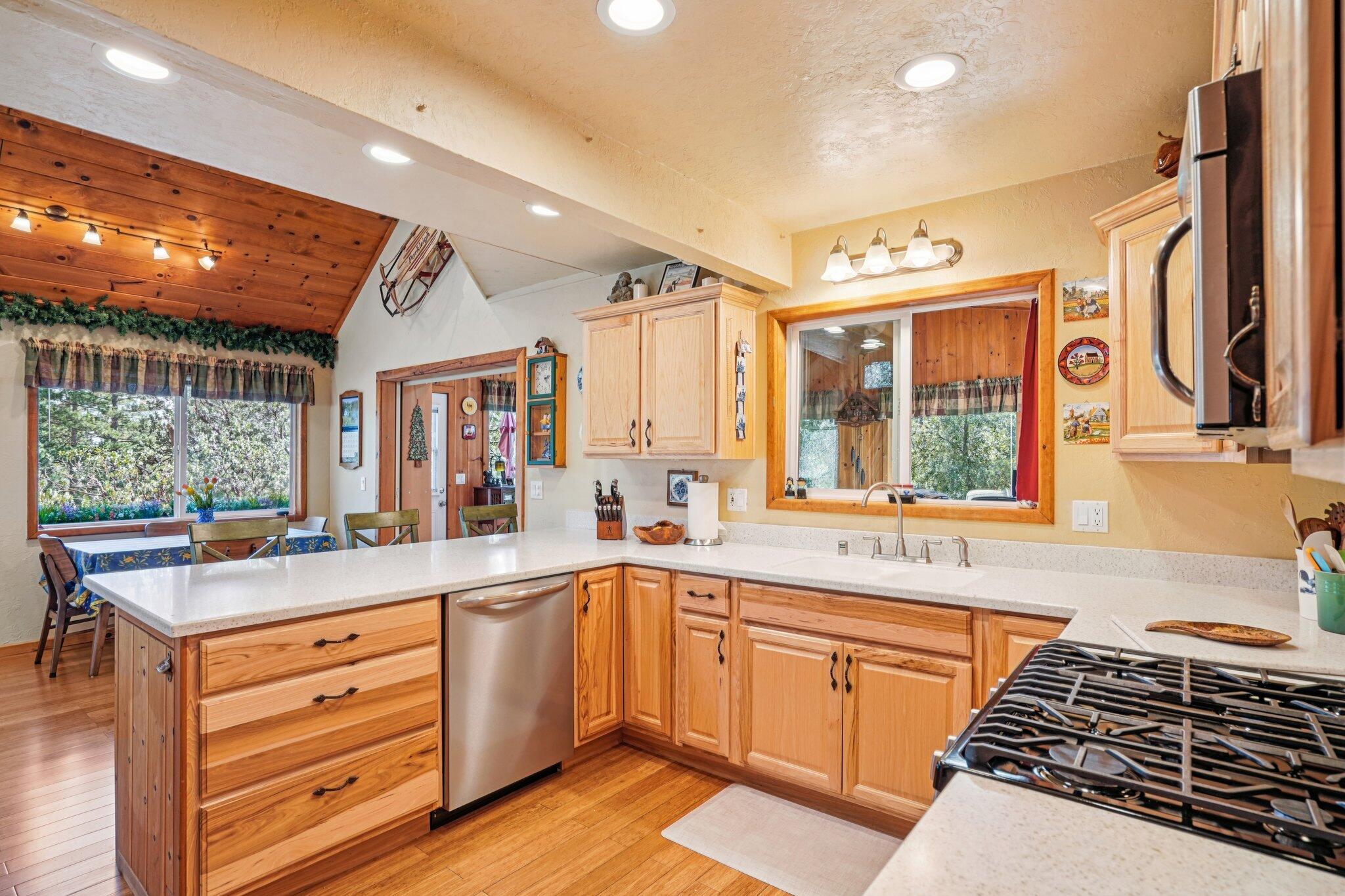 25361 Skyline Way Idyllwild, CA 92549 - Photo 15 of 42 a kitchen with a sink stove and cabinets