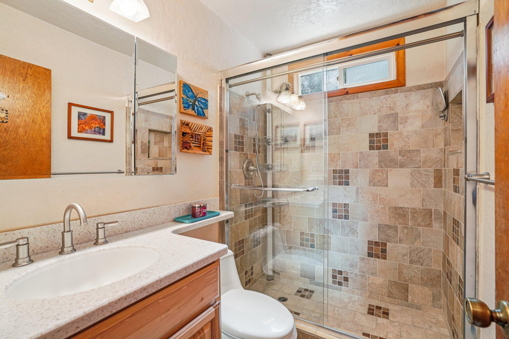 25361 Skyline Way Idyllwild, CA 92549 - Photo 18 of 42 a bathroom with a sink toilet and shower