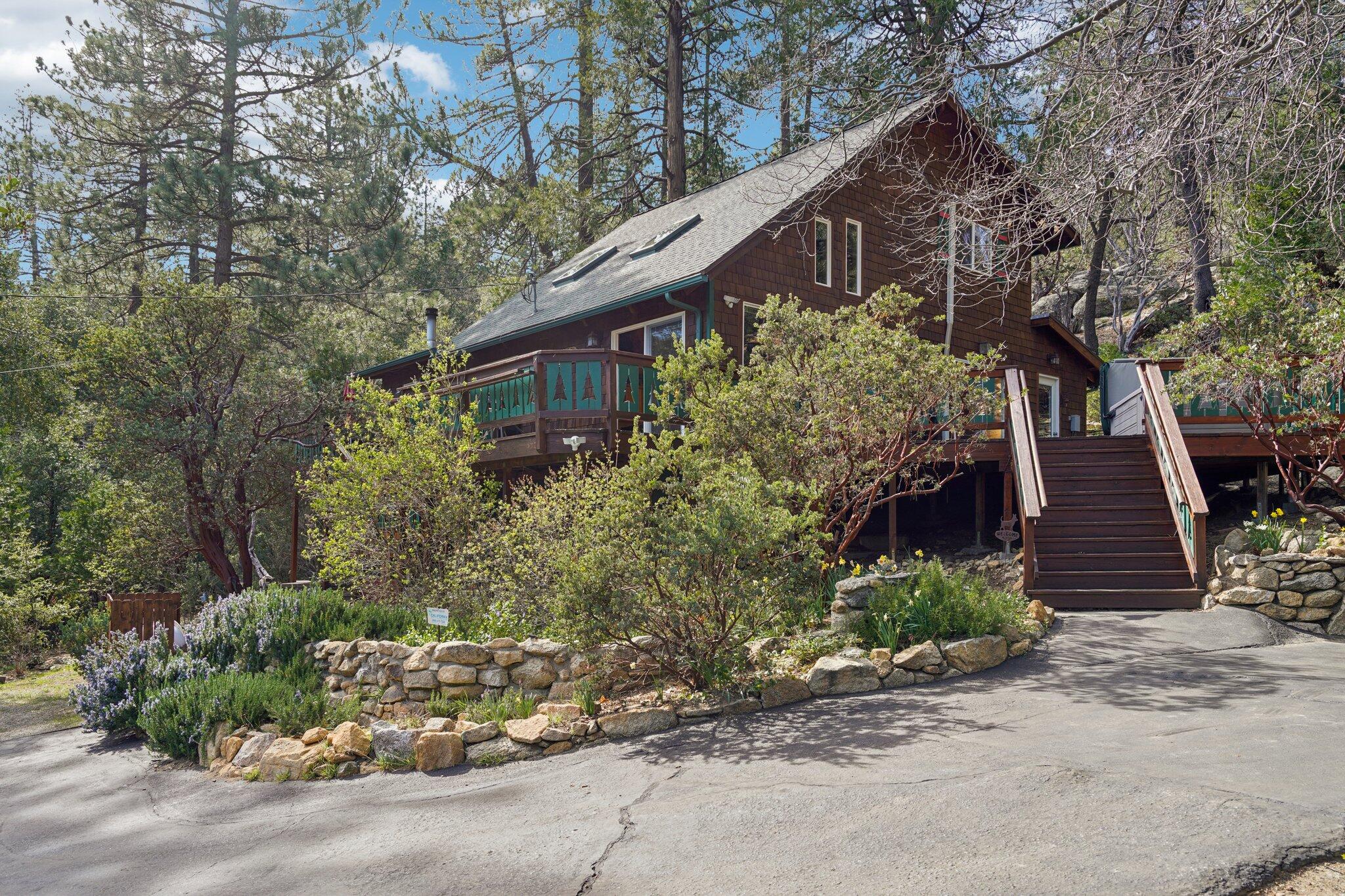 25361 Skyline Way Idyllwild, CA 92549 - Photo 2 of 42 a backyard of a house with lots of green space