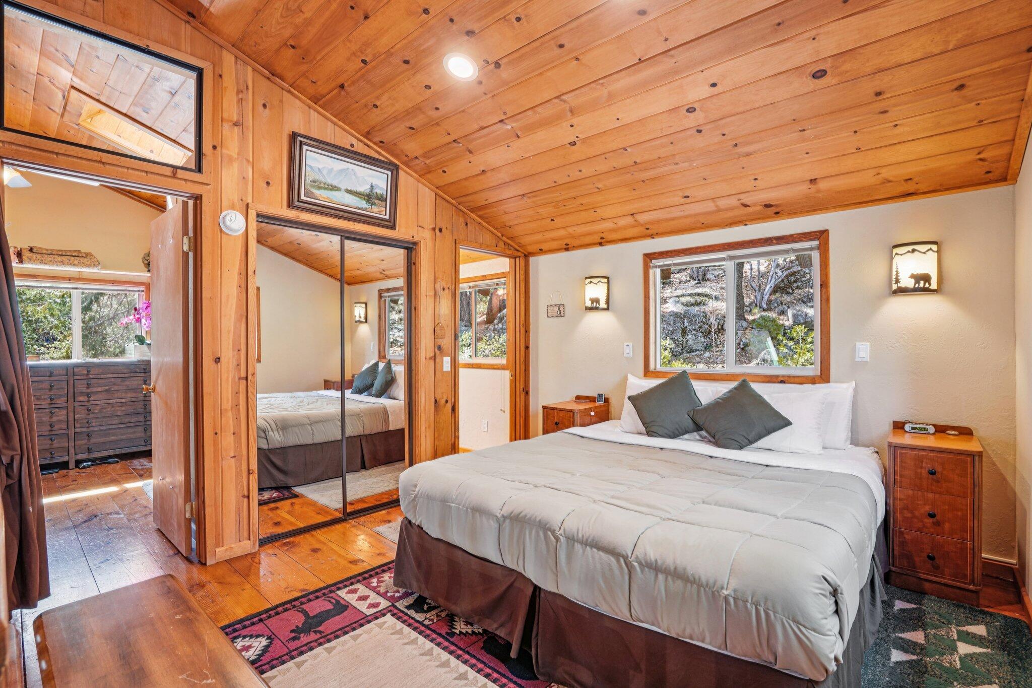 25361 Skyline Way Idyllwild, CA 92549 - Photo 21 of 42 a bedroom with a bed and wooden floor