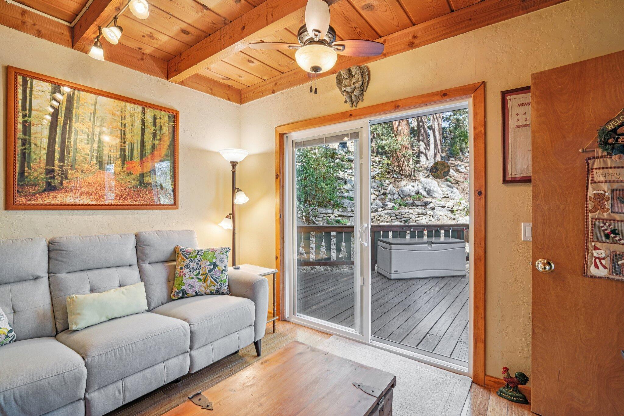 25361 Skyline Way Idyllwild, CA 92549 - Photo 27 of 42 a living room with furniture and a floor to ceiling window