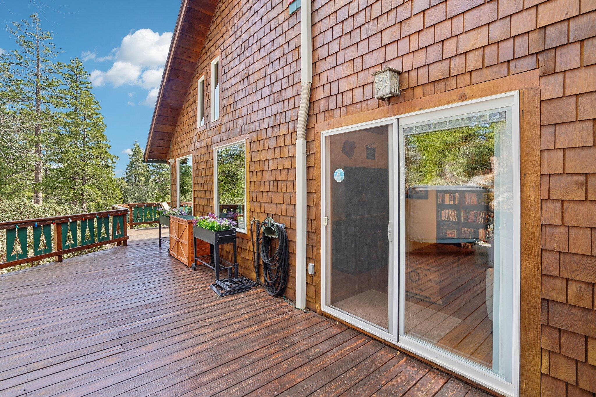 25361 Skyline Way Idyllwild, CA 92549 - Photo 30 of 42 a view of a balcony with chairs and wooden floor
