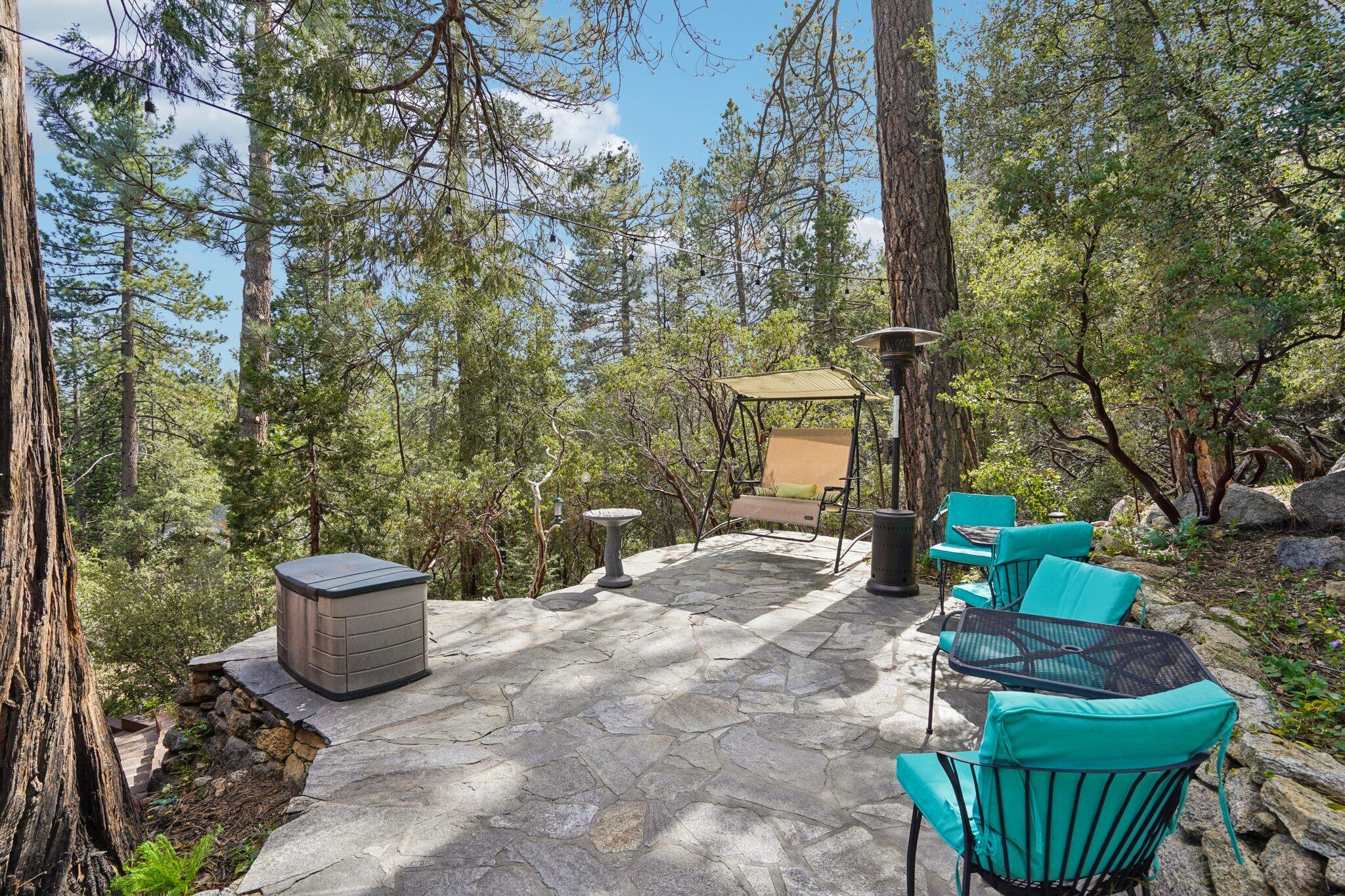 25361 Skyline Way Idyllwild, CA 92549 - Photo 35 of 42 a view of a chair and table in backyard
