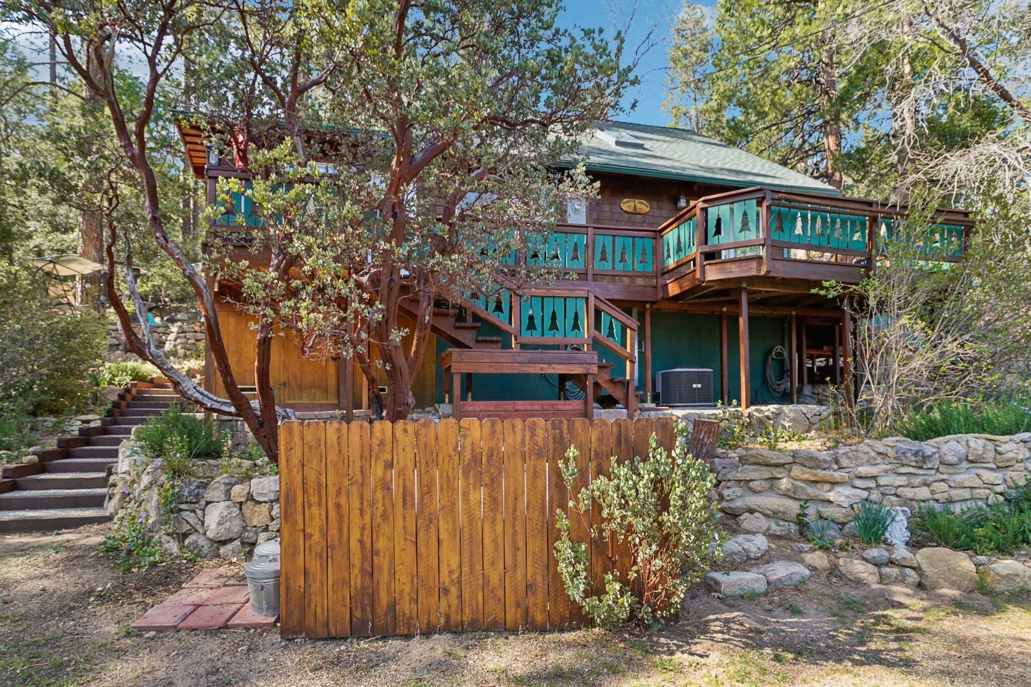 25361 Skyline Way Idyllwild, CA 92549 - Photo 39 of 42 a front view of a house with a garden
