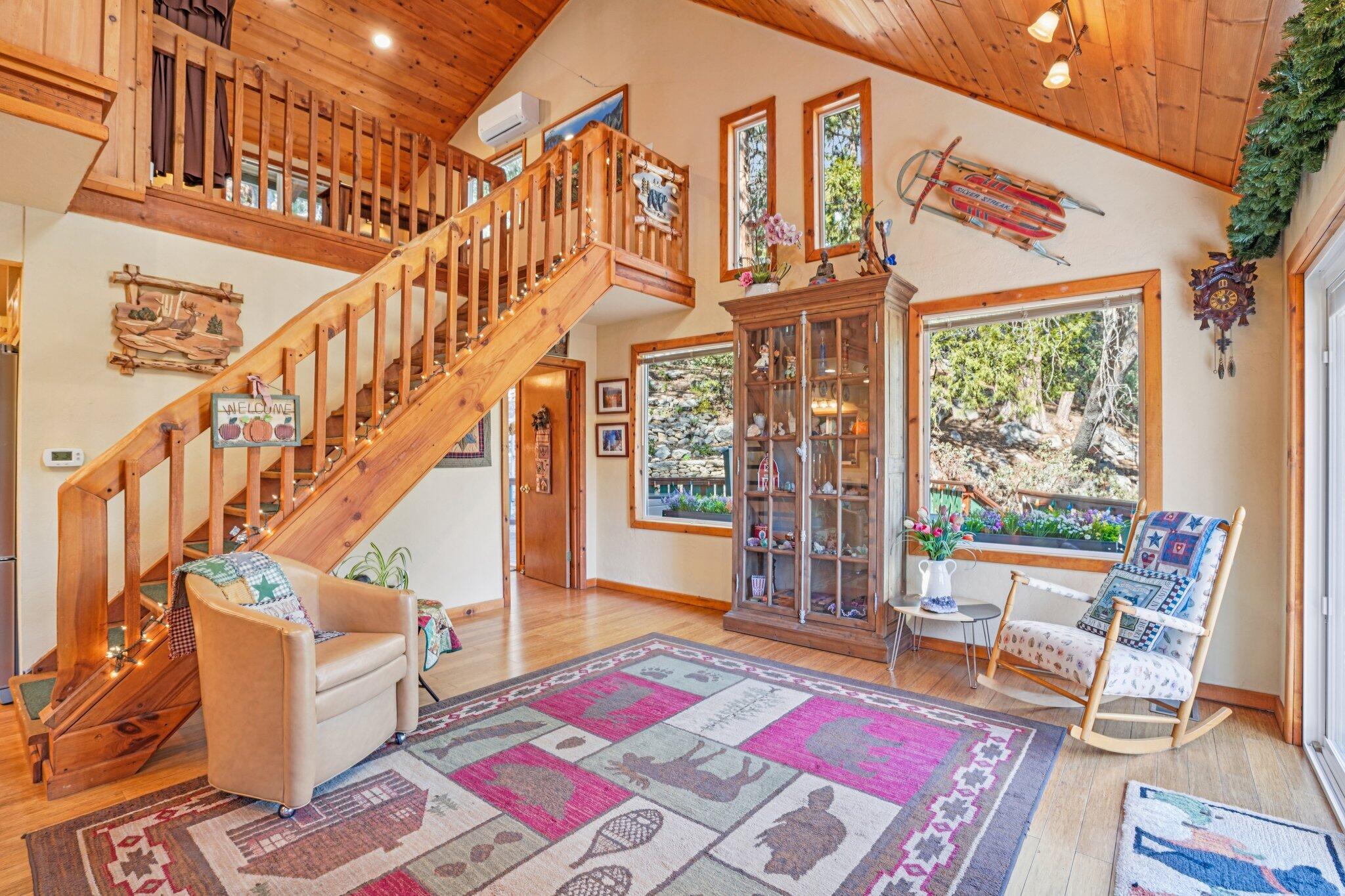 25361 Skyline Way Idyllwild, CA 92549 - Photo 4 of 42 a front view of a building with glass windows and rug