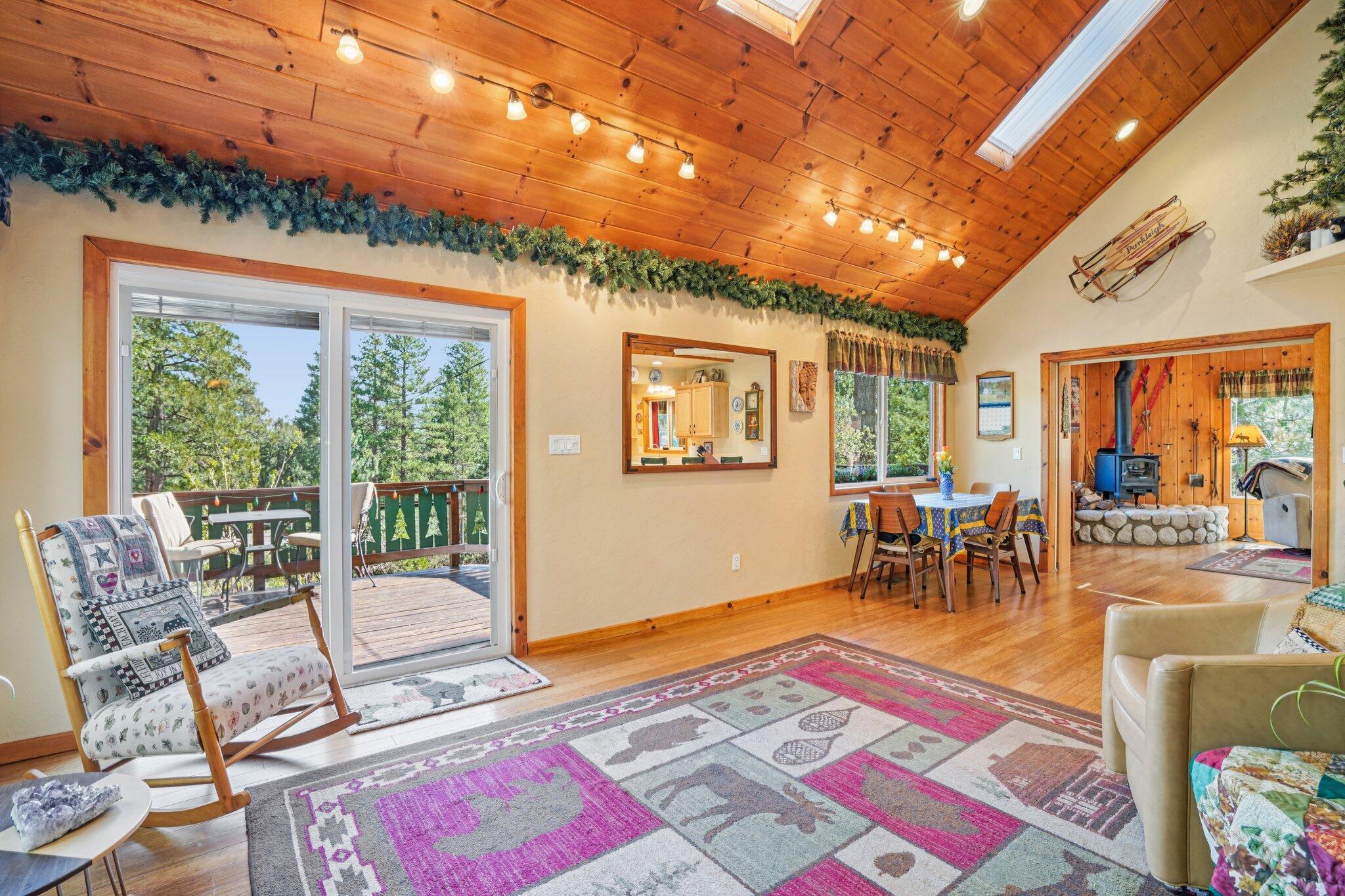 25361 Skyline Way Idyllwild, CA 92549 - Photo 6 of 42 a living room with furniture a rug and a large window