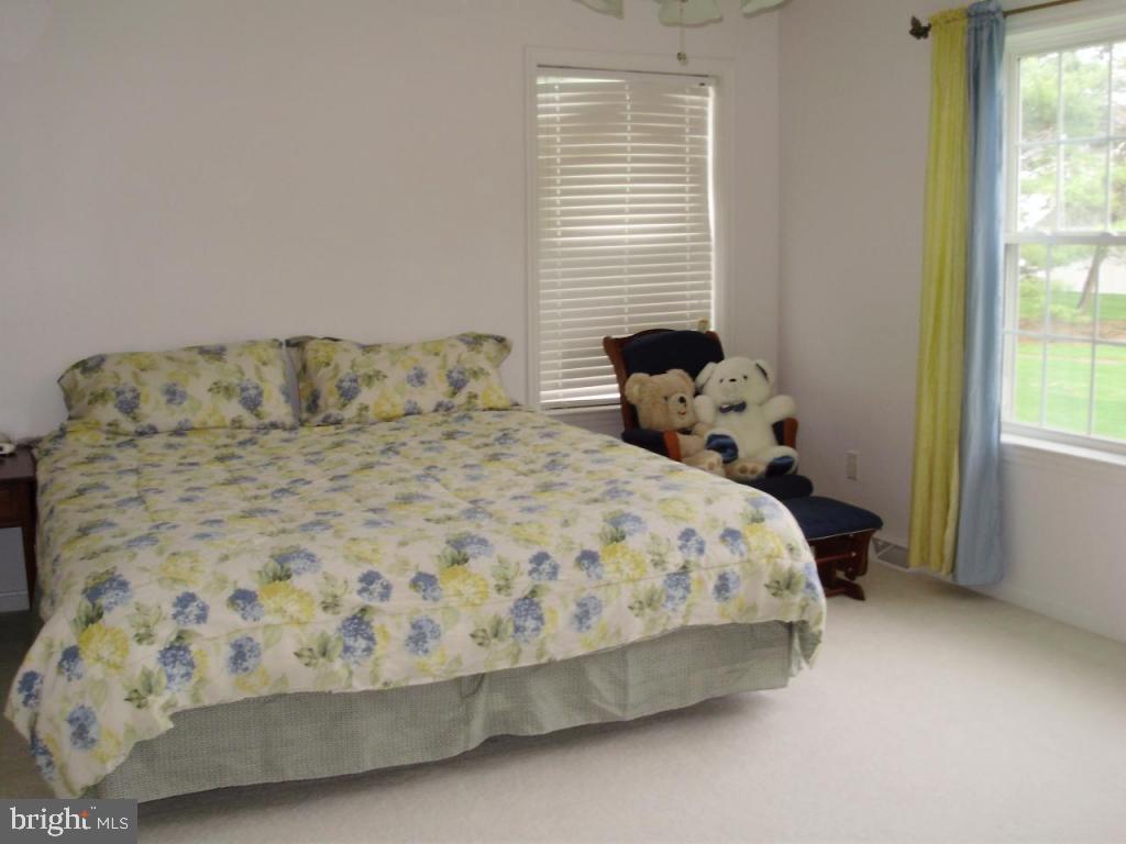 608 Wallingford Road Lititz, PA 17543 - Photo 12 of 30 a bed sitting in a bedroom next to a window