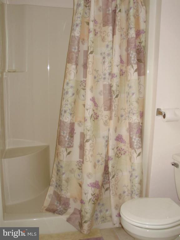 608 Wallingford Road Lititz, PA 17543 - Photo 16 of 30 a white toilet sitting next to a bath tub