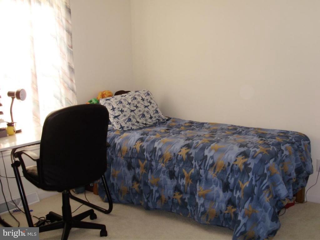 608 Wallingford Road Lititz, PA 17543 - Photo 20 of 30 a bed sitting in a room next to a window