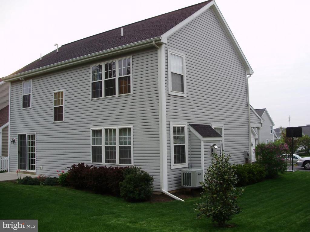 608 Wallingford Road Lititz, PA 17543 - Photo 27 of 30 a front view of a house with a garden and plants