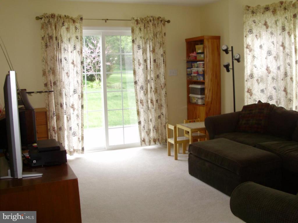 608 Wallingford Road Lititz, PA 17543 - Photo 5 of 30 a living room with furniture and a large window