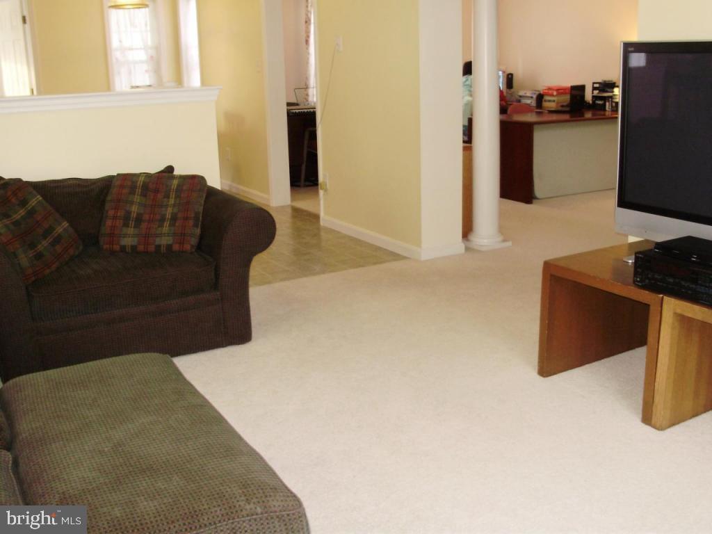 608 Wallingford Road Lititz, PA 17543 - Photo 6 of 30 a living room with furniture and a flat screen tv