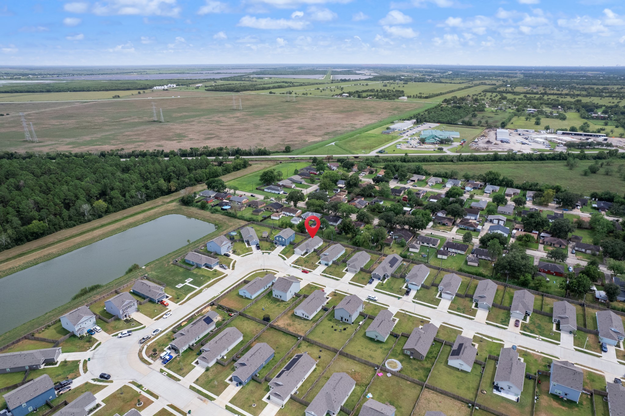 252 Houston Street Angleton, TX 77515 - Photo 47 of 49 Expansive aerial view highlights the property’s position within the neighborhood and the mix of residential and open surroundings.