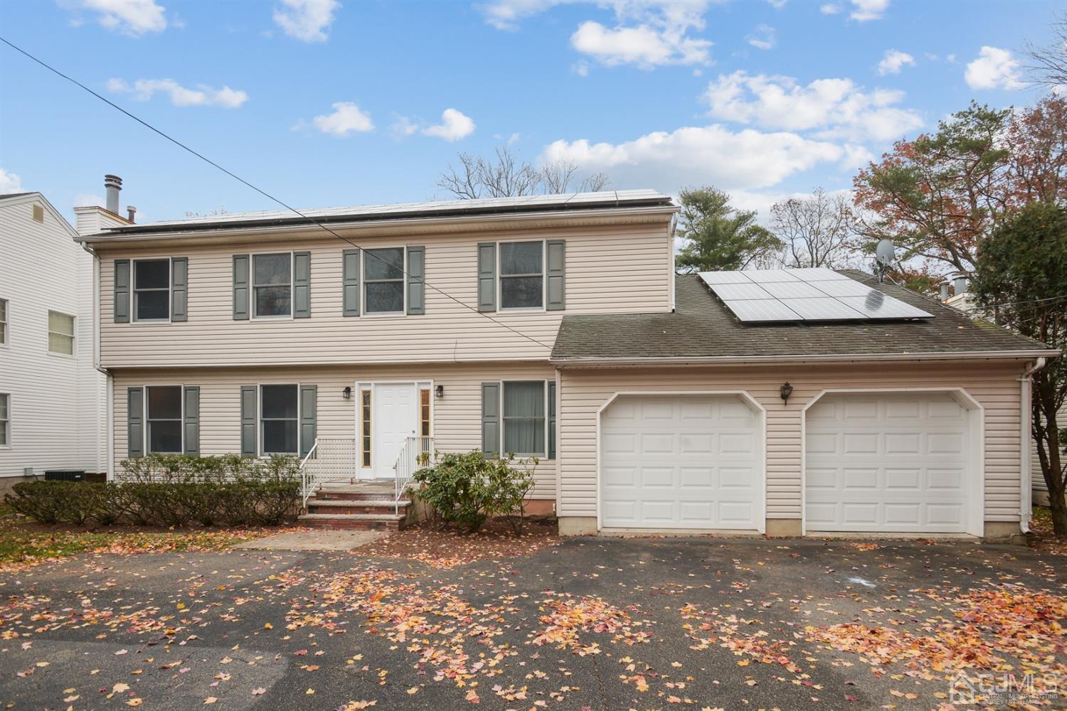 188 Plainfield Road Edison, NJ 08820 - Photo 1 of 16 a front view of a house with a yard and garage