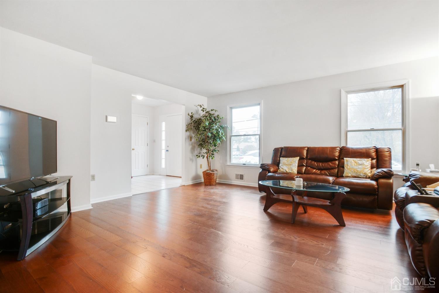 188 Plainfield Road Edison, NJ 08820 - Photo 2 of 16 a living room with furniture and a flat screen tv