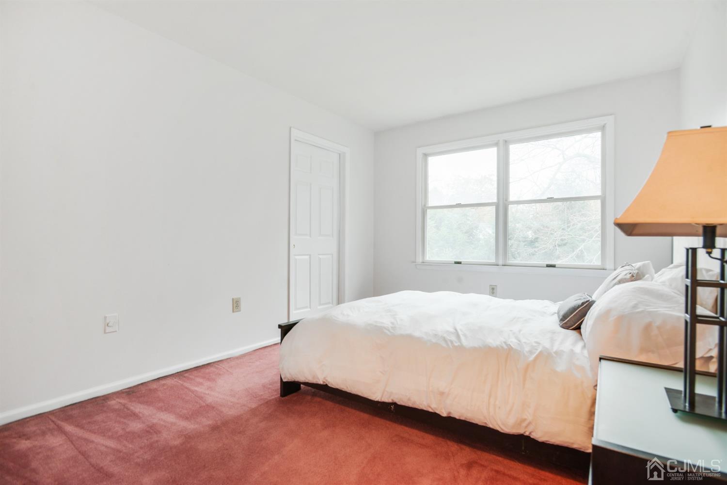 188 Plainfield Road Edison, NJ 08820 - Photo 12 of 16 a bedroom with a bed and a window