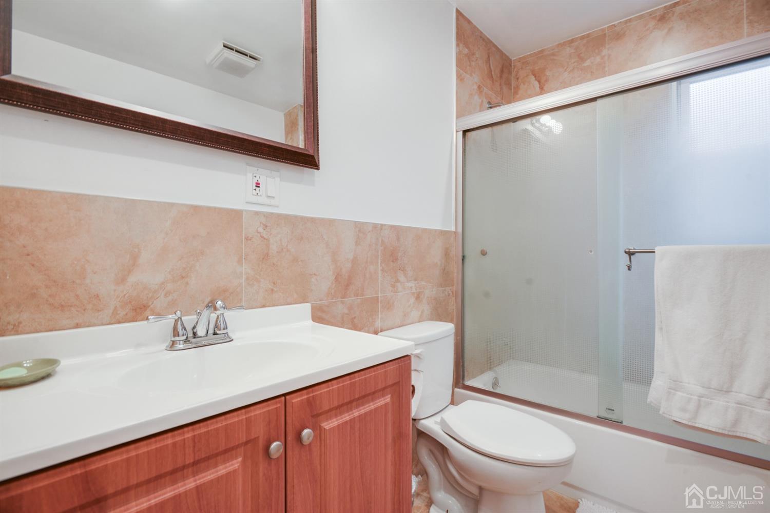188 Plainfield Road Edison, NJ 08820 - Photo 14 of 16 a bathroom with a sink a toilet and shower