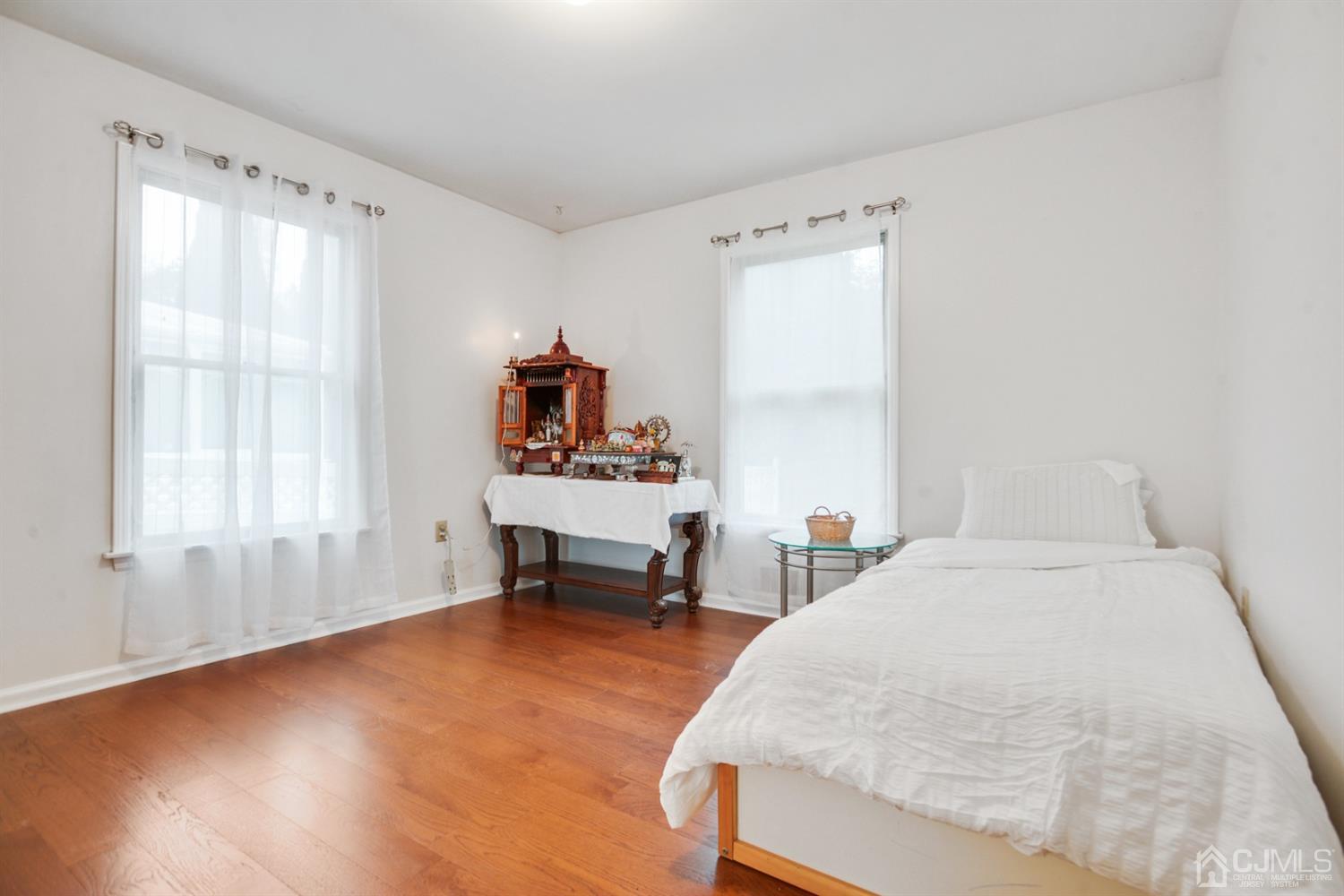 188 Plainfield Road Edison, NJ 08820 - Photo 5 of 16 a bedroom with a bed and a window