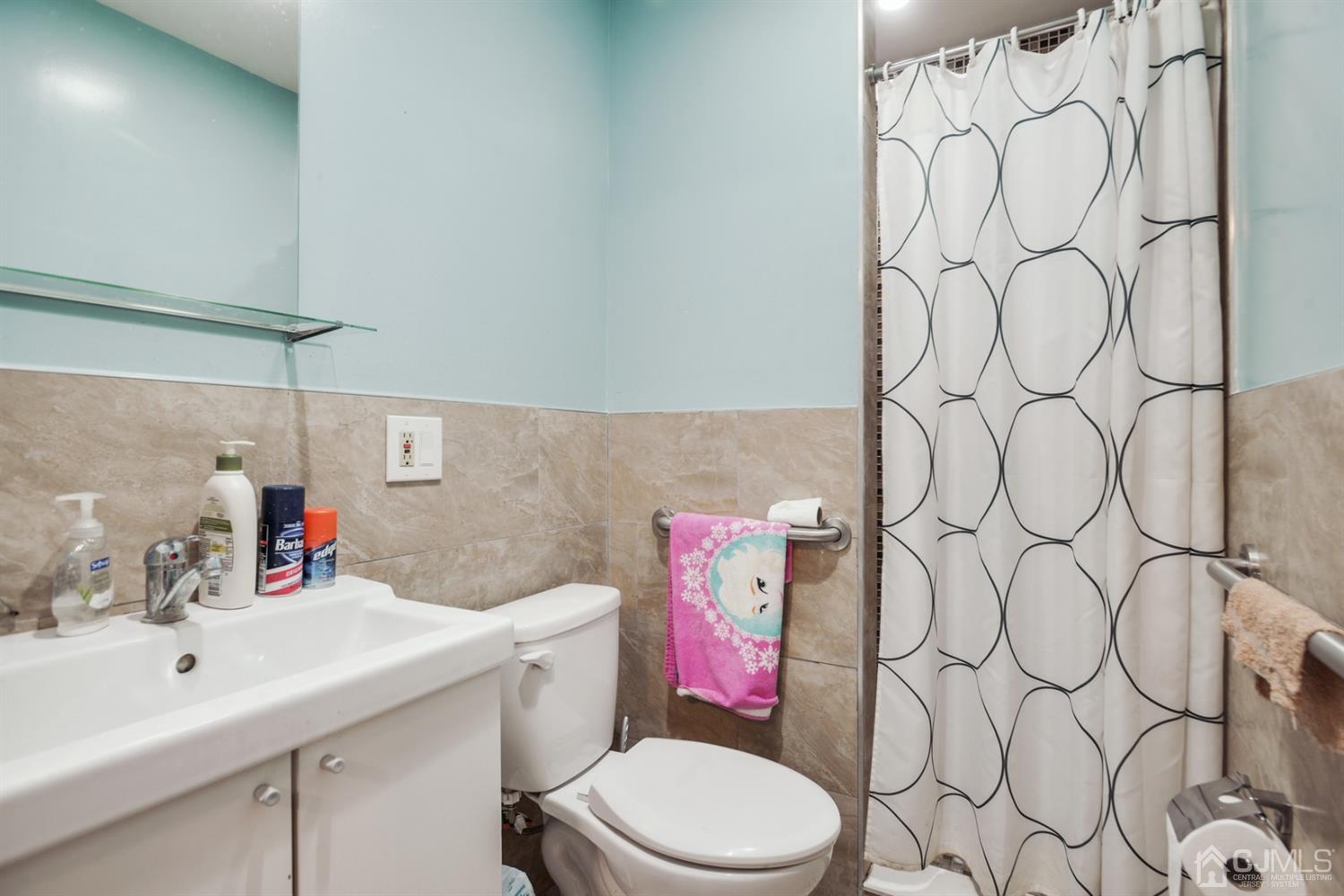 188 Plainfield Road Edison, NJ 08820 - Photo 8 of 16 a bathroom with a sink vanity mirror and toilet