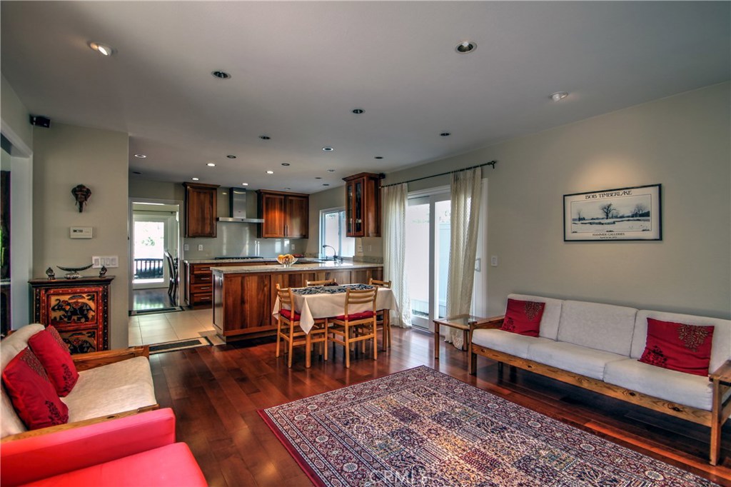 27 Silver Crescent Irvine, CA 92603 - Photo 18 of 30 a living room with furniture wooden floor and kitchen view