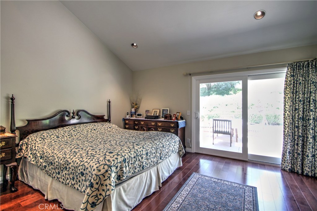 27 Silver Crescent Irvine, CA 92603 - Photo 19 of 30 a bedroom with a bed and wooden floor