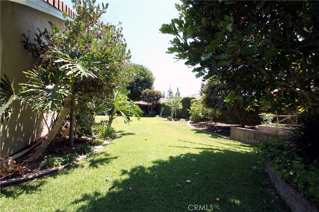 27 Silver Crescent Irvine, CA 92603 - Photo 27 of 30 a view of backyard with swimming pool