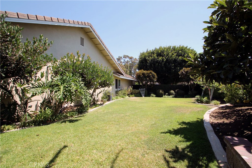 27 Silver Crescent Irvine, CA 92603 - Photo 28 of 30 a view of outdoor space with garden