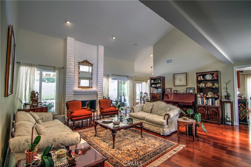 27 Silver Crescent Irvine, CA 92603 - Photo 3 of 30 a living room with furniture and wooden floor