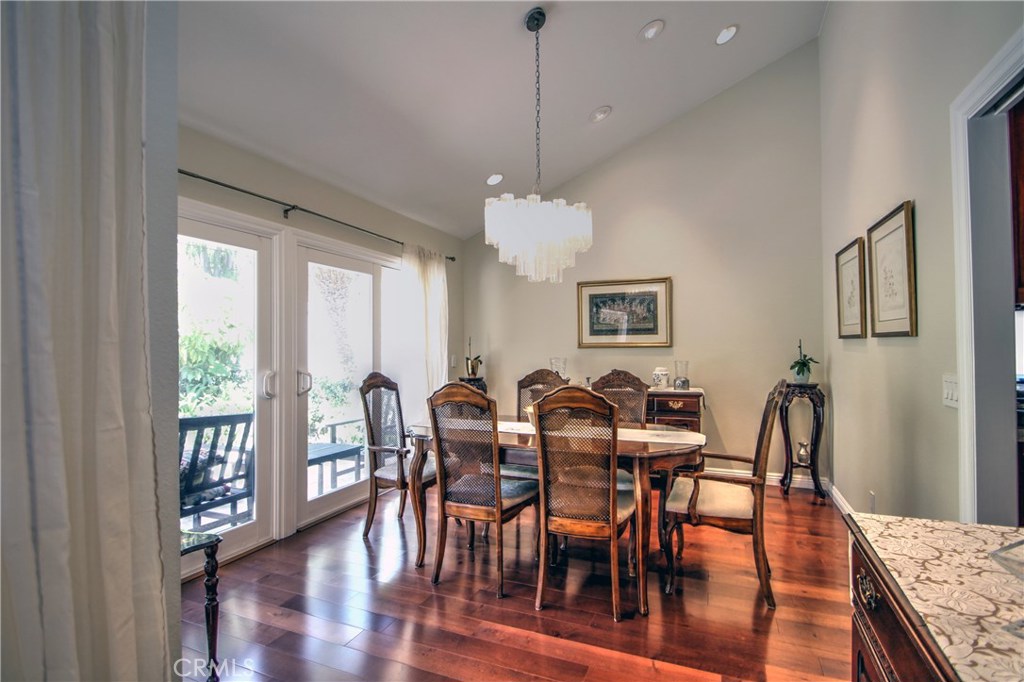 27 Silver Crescent Irvine, CA 92603 - Photo 7 of 30 a view of a dining room with furniture window and wooden floor