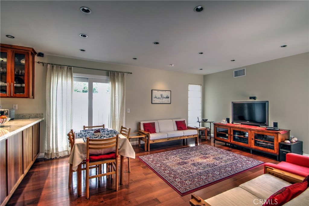 27 Silver Crescent Irvine, CA 92603 - Photo 10 of 30 a living room with furniture and a flat screen tv