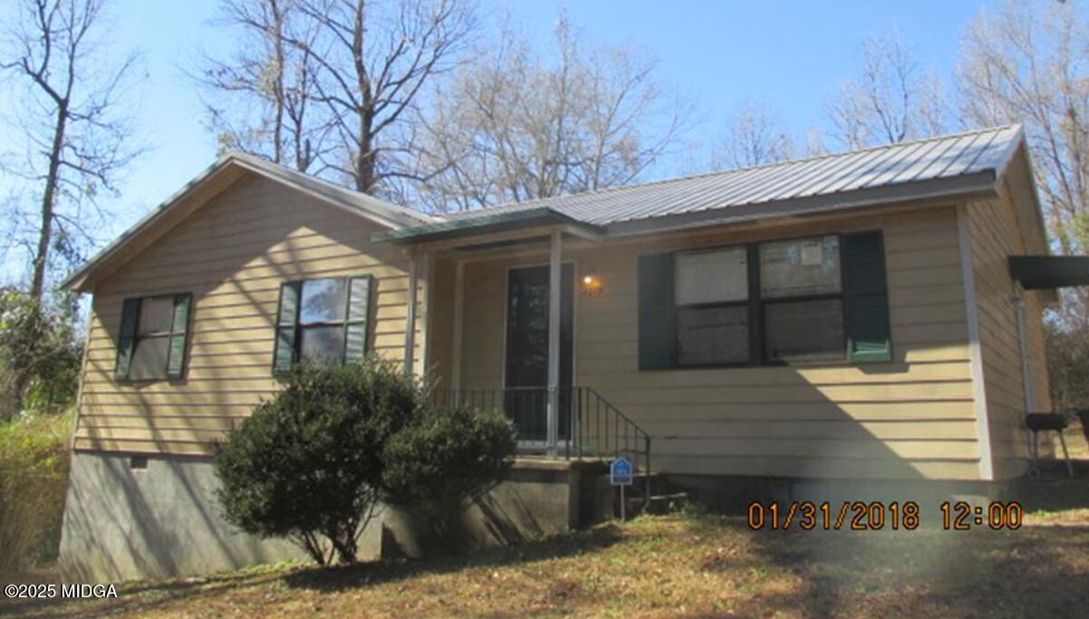 4819 Massey Road Macon, GA 31206 - Photo 1 of 11 a front view of house with trees