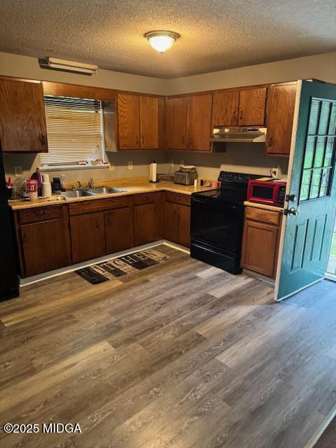4819 Massey Road Macon, GA 31206 - Photo 2 of 11 a kitchen with granite countertop a sink cabinets and stainless steel appliances