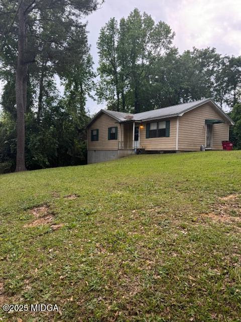 4819 Massey Road Macon, GA 31206 - Photo 10 of 11 a house that is sitting in the middle of forest