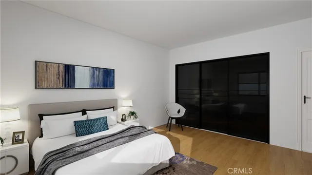 a bedroom with a bed and a dresser