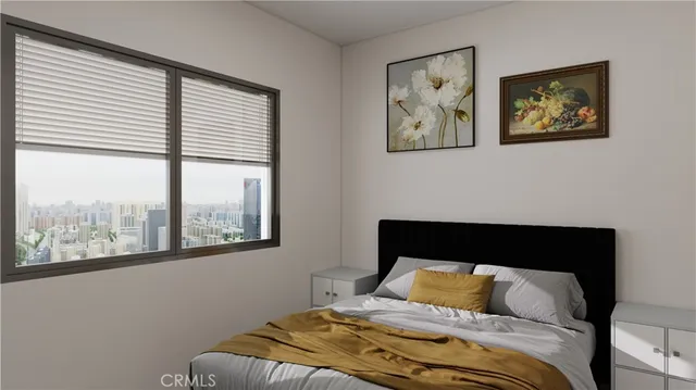 a bedroom with a large bed and a window