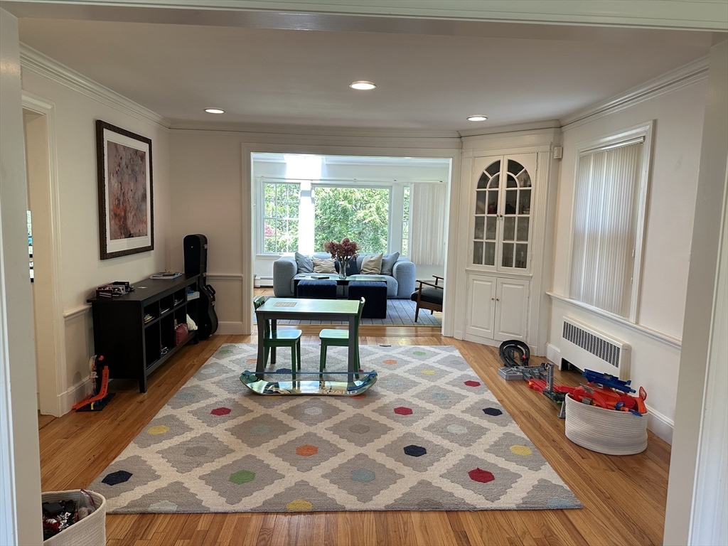 45 Wellesley Road Belmont, MA 02478 - Photo 12 of 42 a living room with furniture a rug kitchen view and large windows
