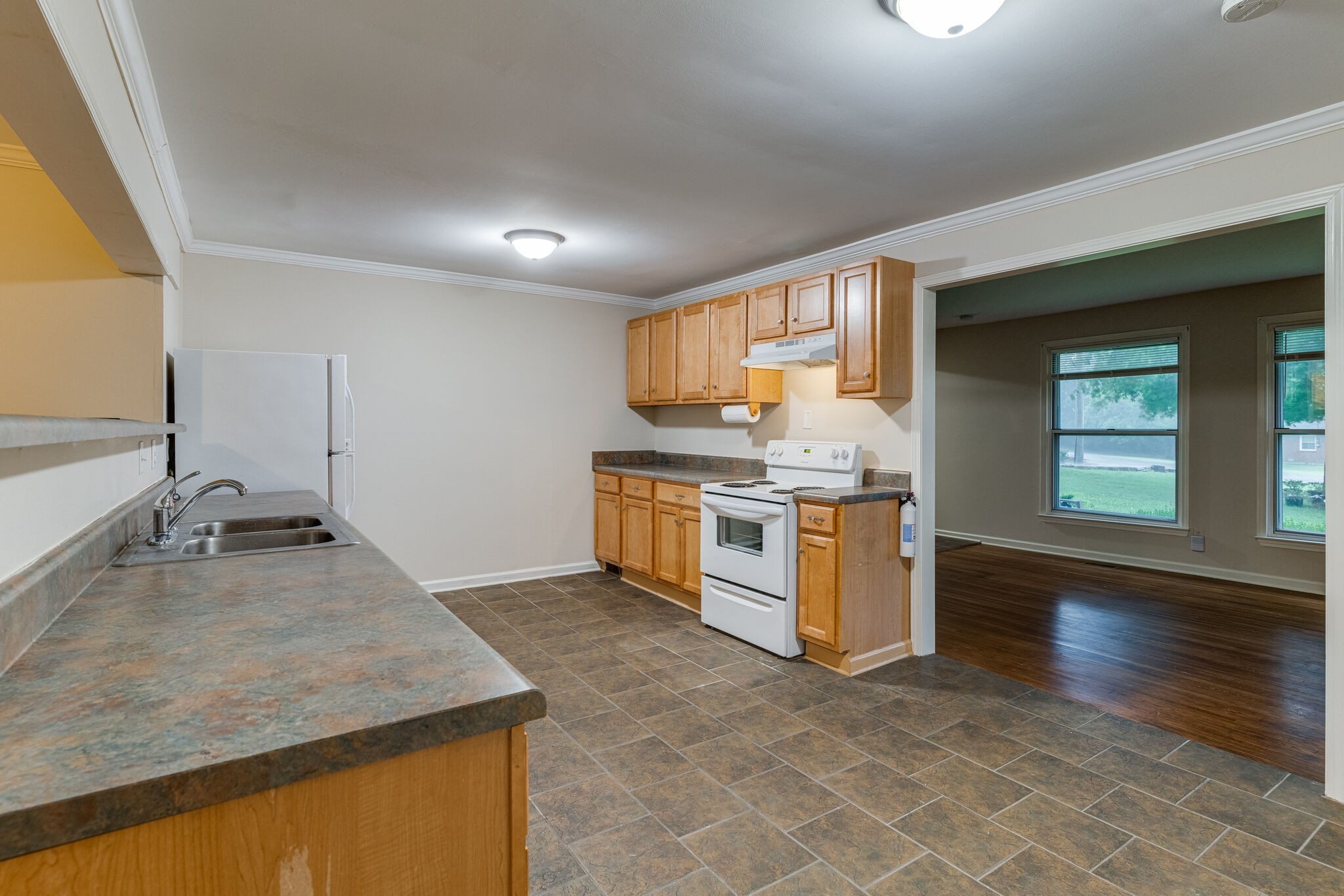 808 Nesbitt Lane Madison, TN 37115 - Photo 13 of 38 a kitchen with stainless steel appliances granite countertop a sink stove and cabinets