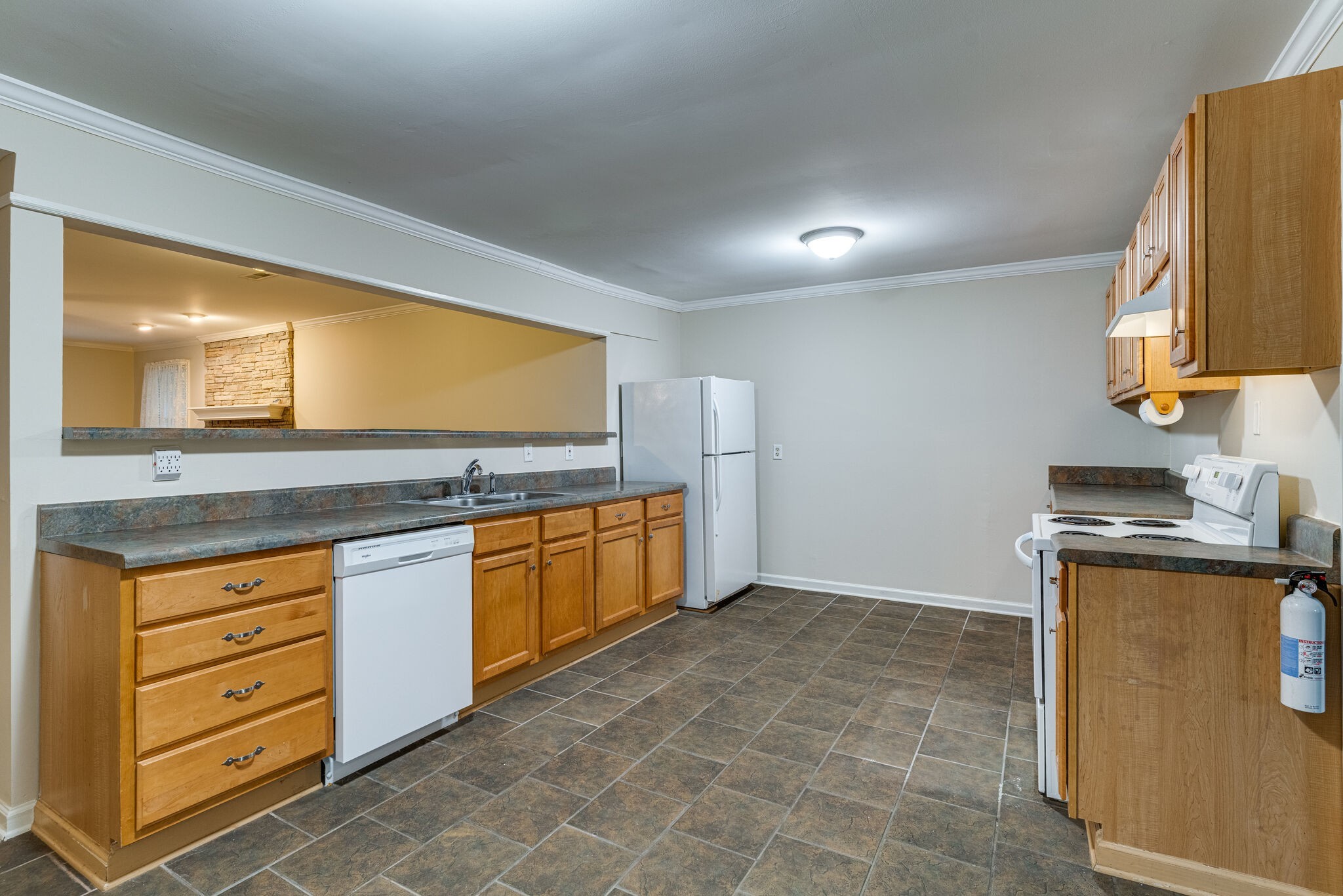 808 Nesbitt Lane Madison, TN 37115 - Photo 14 of 38 a kitchen with granite countertop a sink and a stove top oven