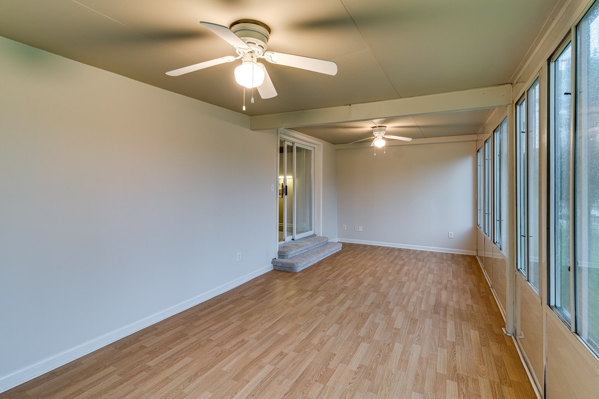 808 Nesbitt Lane Madison, TN 37115 - Photo 18 of 38 wooden floor in an empty room with a window