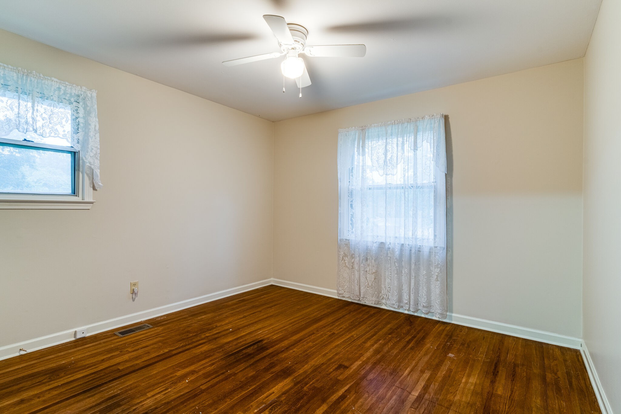 808 Nesbitt Lane Madison, TN 37115 - Photo 19 of 38 a view of empty room with wooden floor and fan