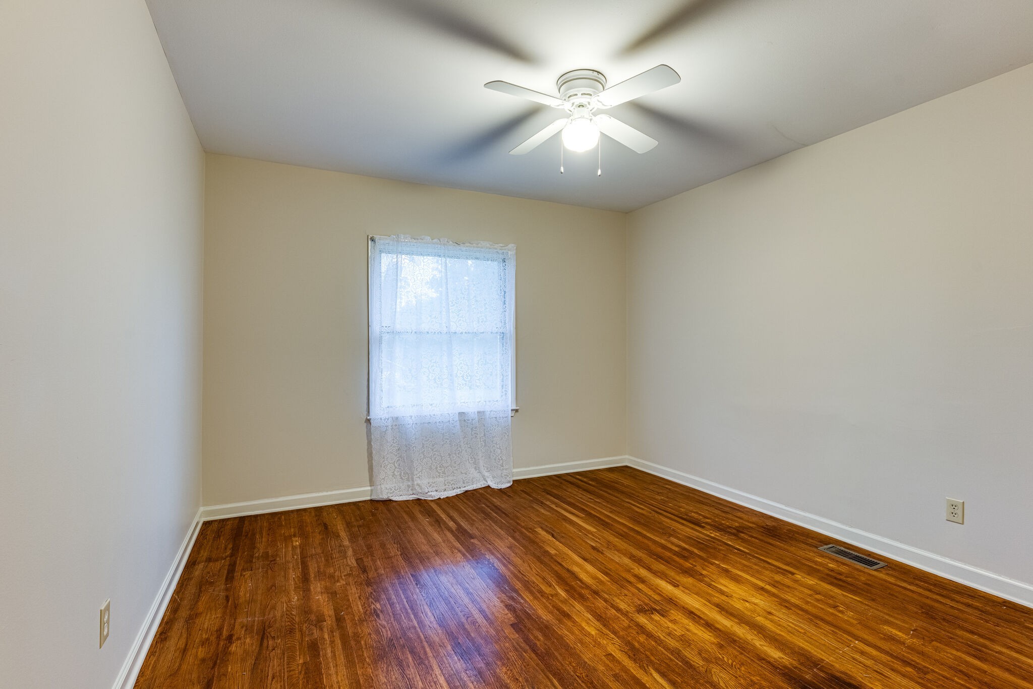 808 Nesbitt Lane Madison, TN 37115 - Photo 25 of 38 an empty room with wooden floor and windows