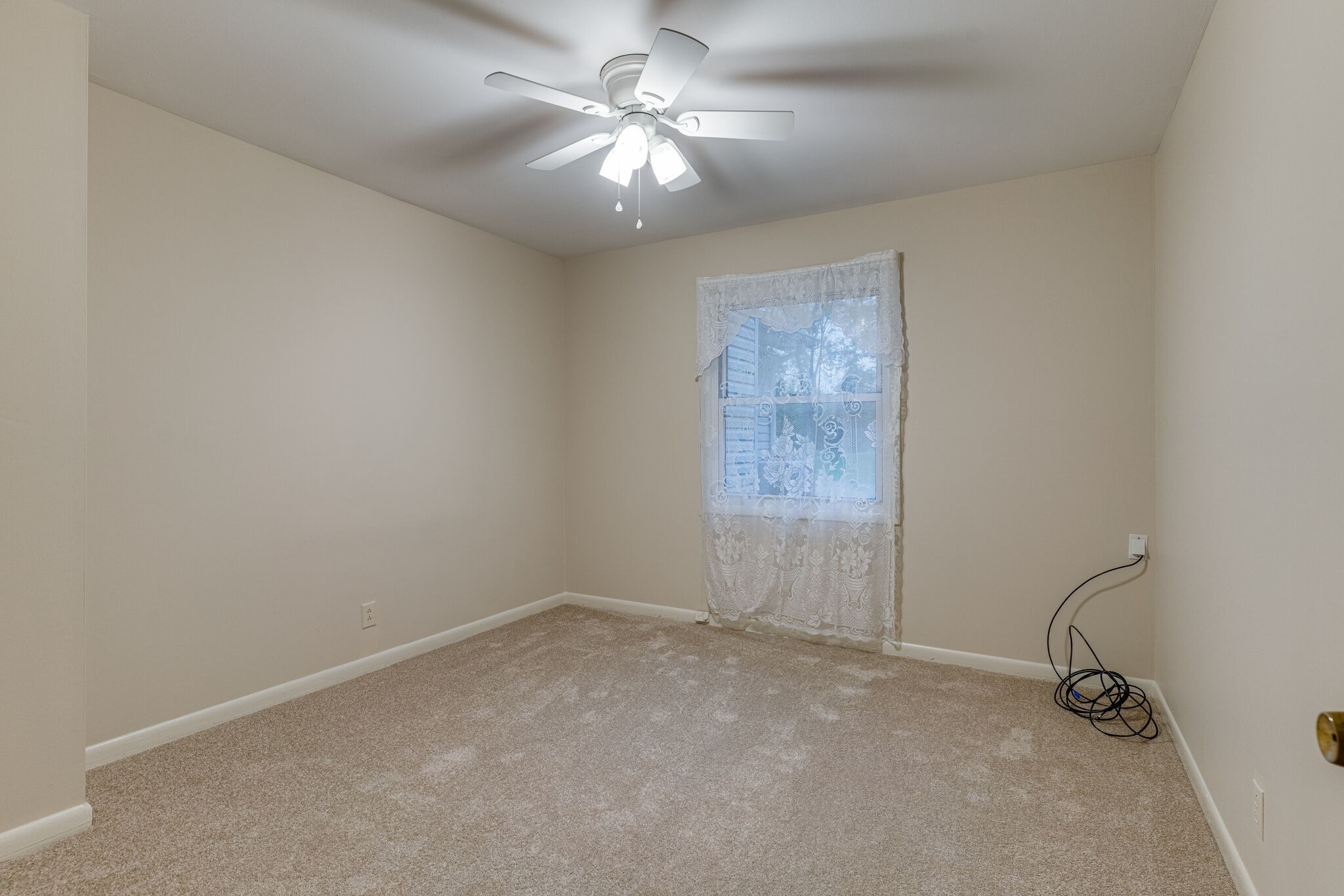 808 Nesbitt Lane Madison, TN 37115 - Photo 32 of 38 an empty room with a chandelier fan and windows