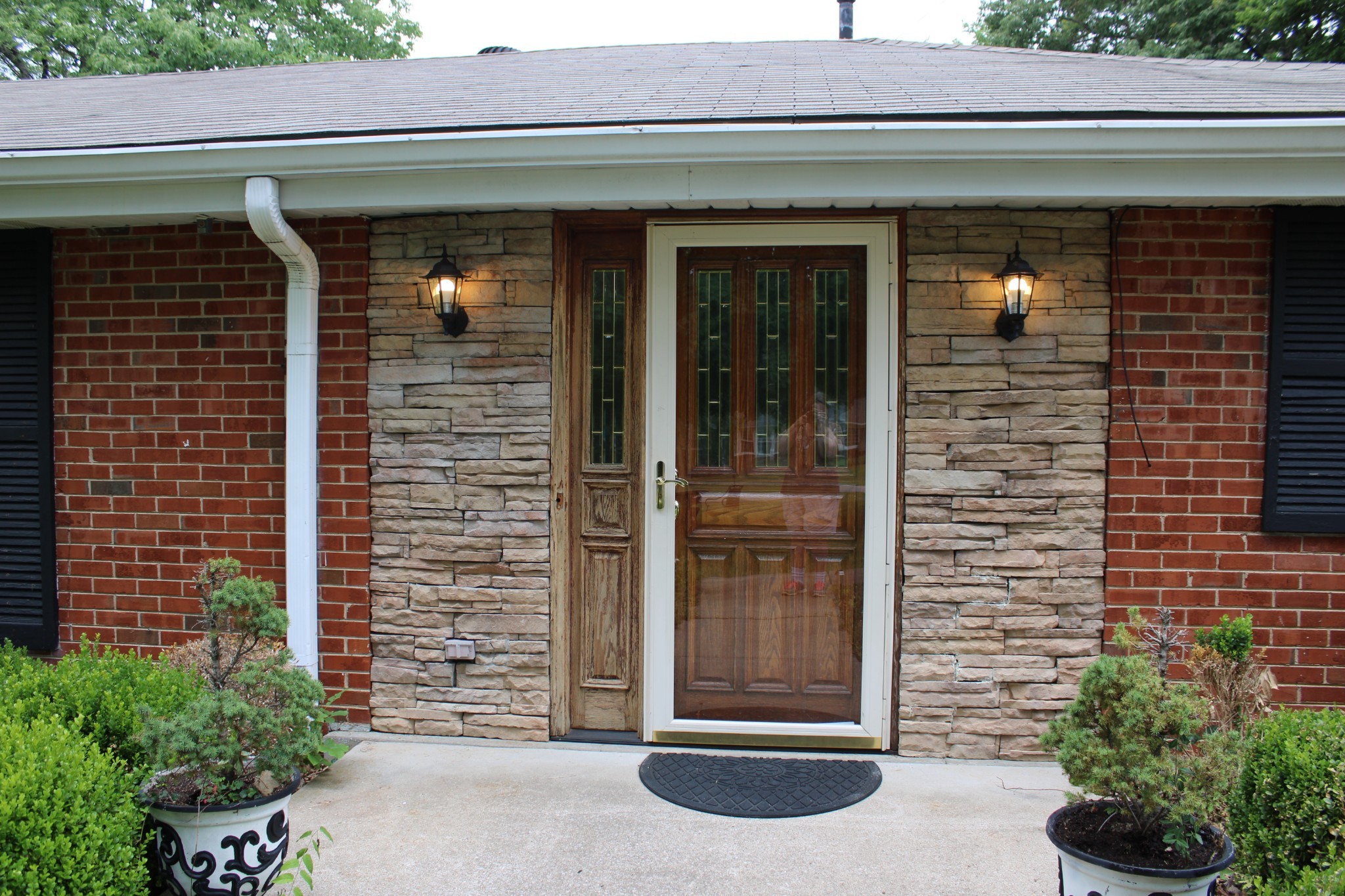 808 Nesbitt Lane Madison, TN 37115 - Photo 6 of 38 a couple of potted plants in front of door