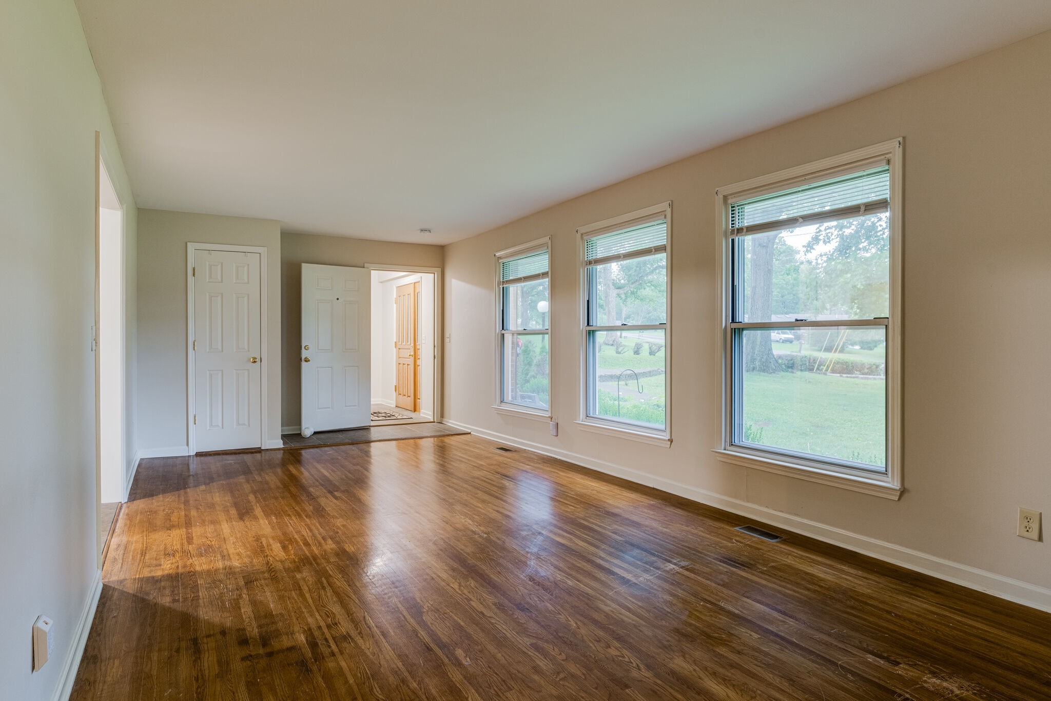 808 Nesbitt Lane Madison, TN 37115 - Photo 7 of 38 a view of an empty room with wooden floor and a window